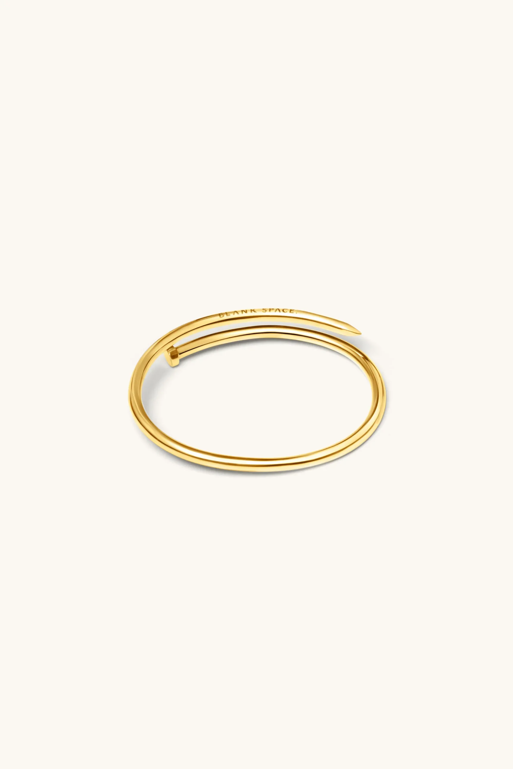 twisted_nail_bangle_kt_go_0.webp 18Kt Gold Plated | Jewellery-BLANK SPACE. TWISTED NAIL BANGLE 18KT GOLD