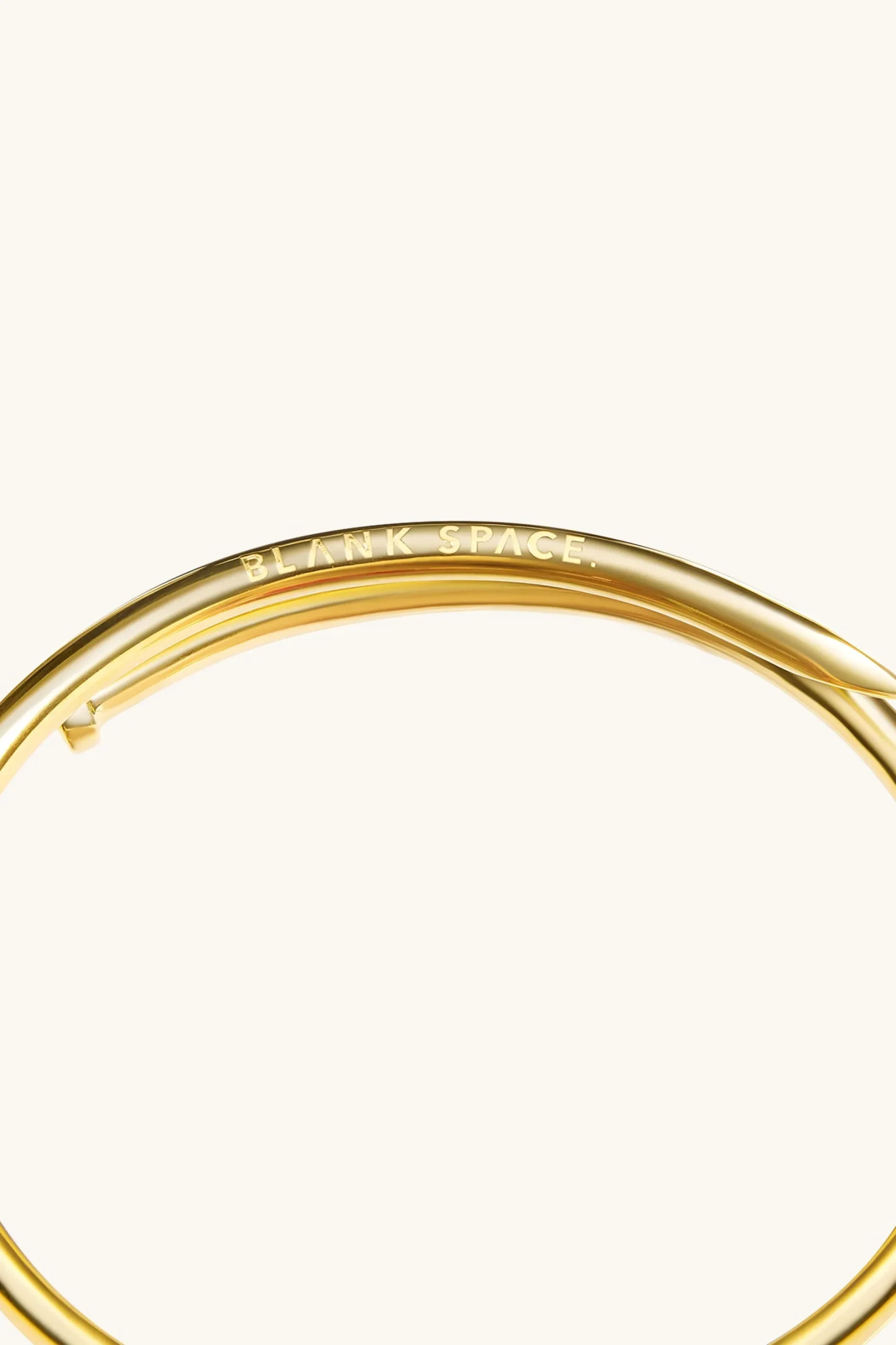 twisted_nail_bangle_kt_go_2.webp 18Kt Gold Plated | Jewellery-BLANK SPACE. TWISTED NAIL BANGLE 18KT GOLD